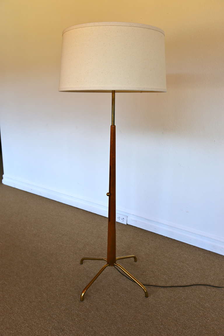 Adjustable height walnut / brass floor lamp by Gerald Thurston for Lightolier.