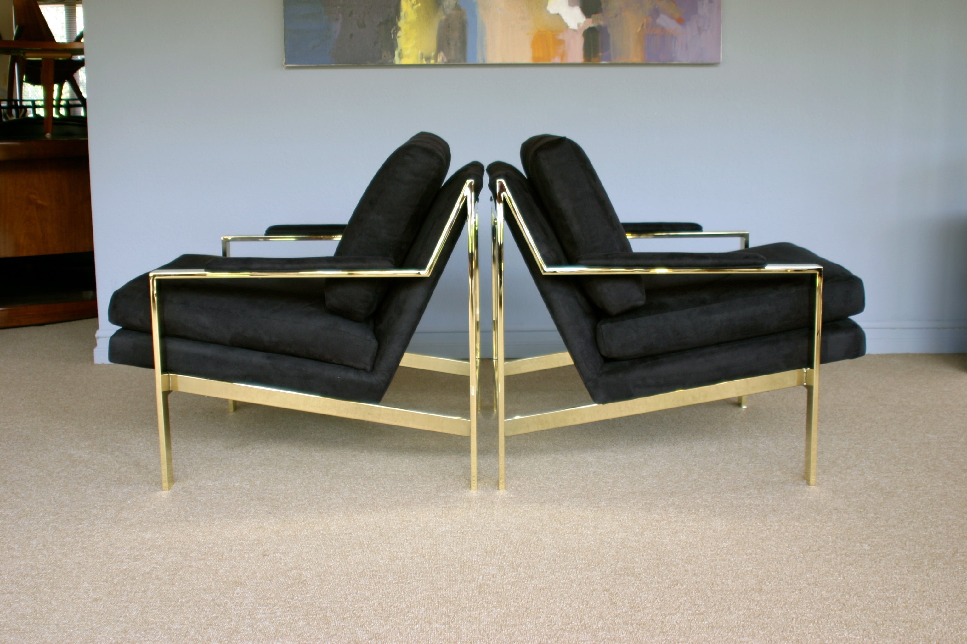 Pair of brass lounge chairs by Milo Baughman