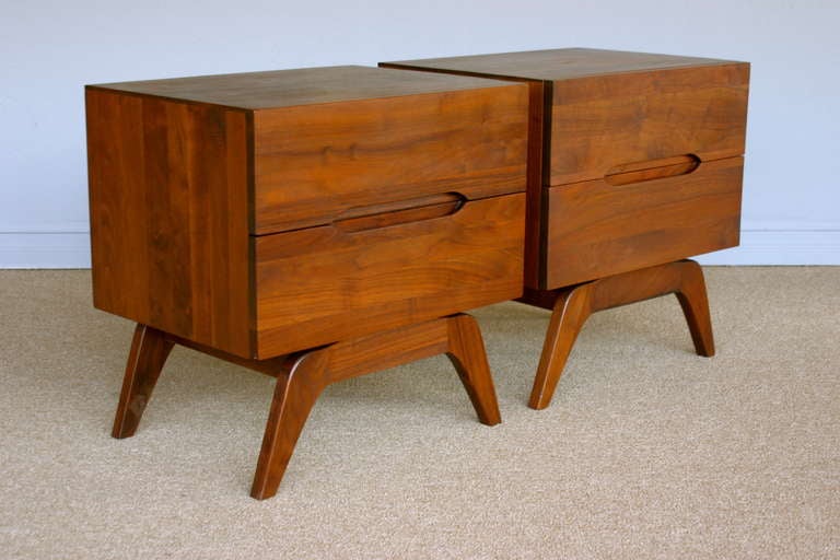 Pair of solid walnut nightstands with sculptural legs.