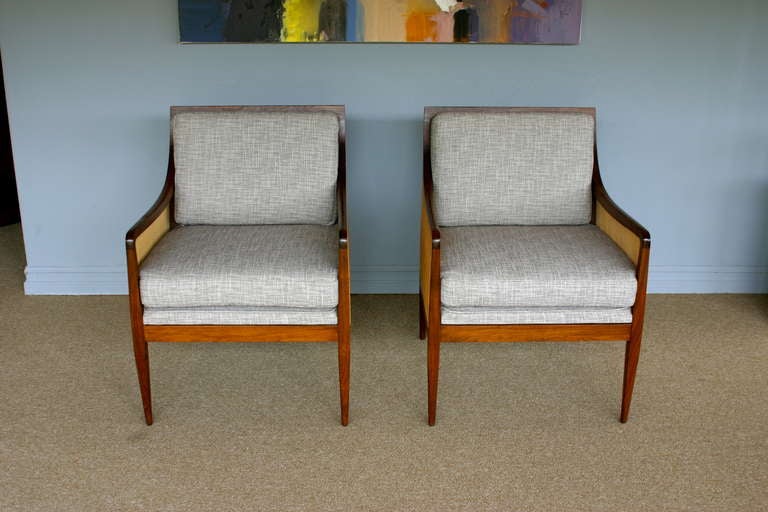 Pair of caned walnut armchairs by Kipp Stewart for Directional.