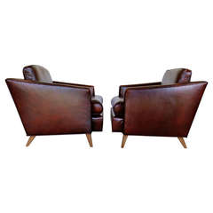 Pair of Ox Blood Leather Lounge Chairs by J. Wanamaker Inc.