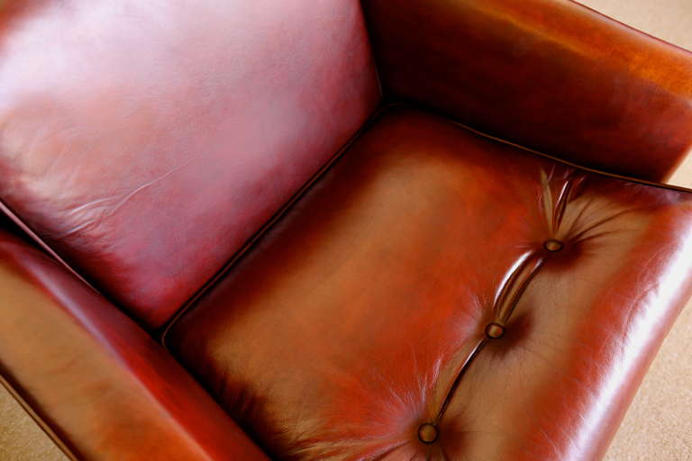 Mid-20th Century Pair of Ox Blood Leather Lounge Chairs by J. Wanamaker Inc.