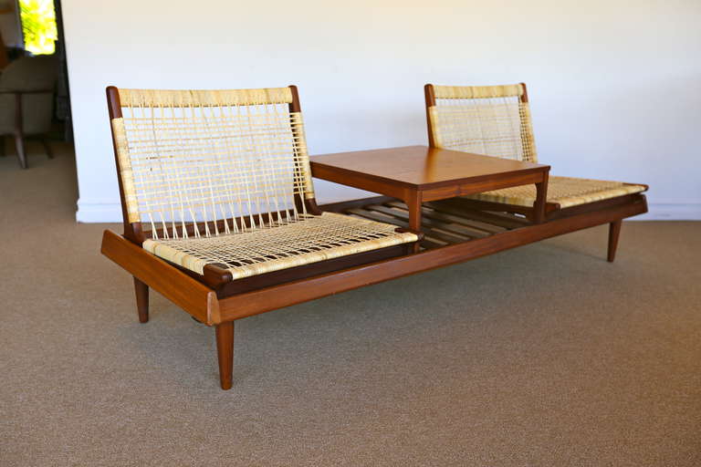 Teak and cane sofa / bench by Hans Olsen. This piece is modular and can be arranged to best meet your needs.