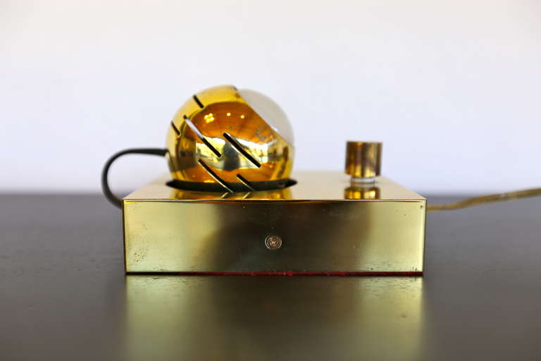 Brass eye ball table lamp by Angelo Lelli for Arredoluce.