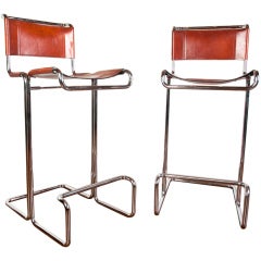 Pair of leather and chrome barstools by Stendig