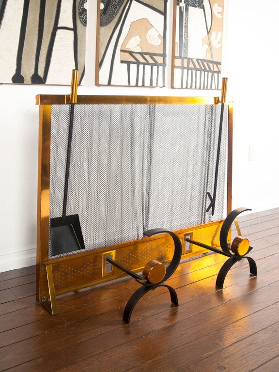 Rare fireplace set consisting of andirons,  screen and tools designed by Donald Deskey.