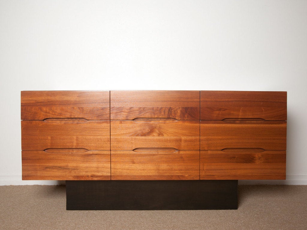 Mid century solid walnut dresser / credenza with ebonized base.  Beautiful walnut grain.  Very clean lines.