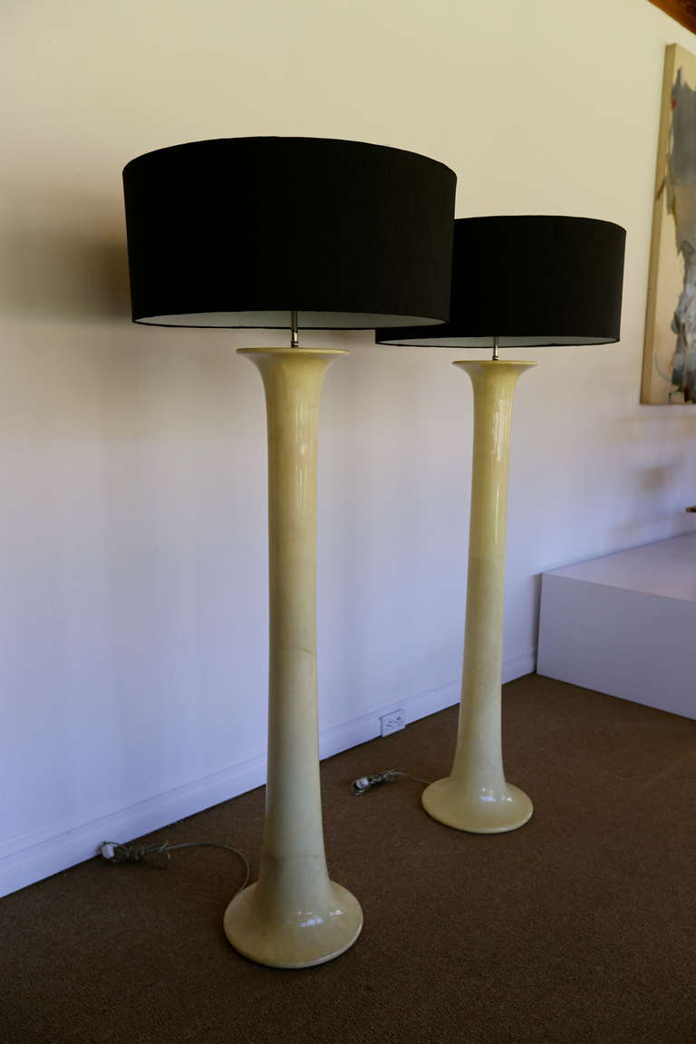 Pair of lacquered goatskin floor lamps.