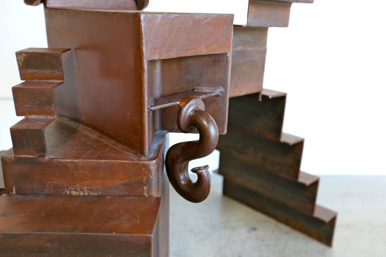 Modernist steel infinite stairs sculpture.