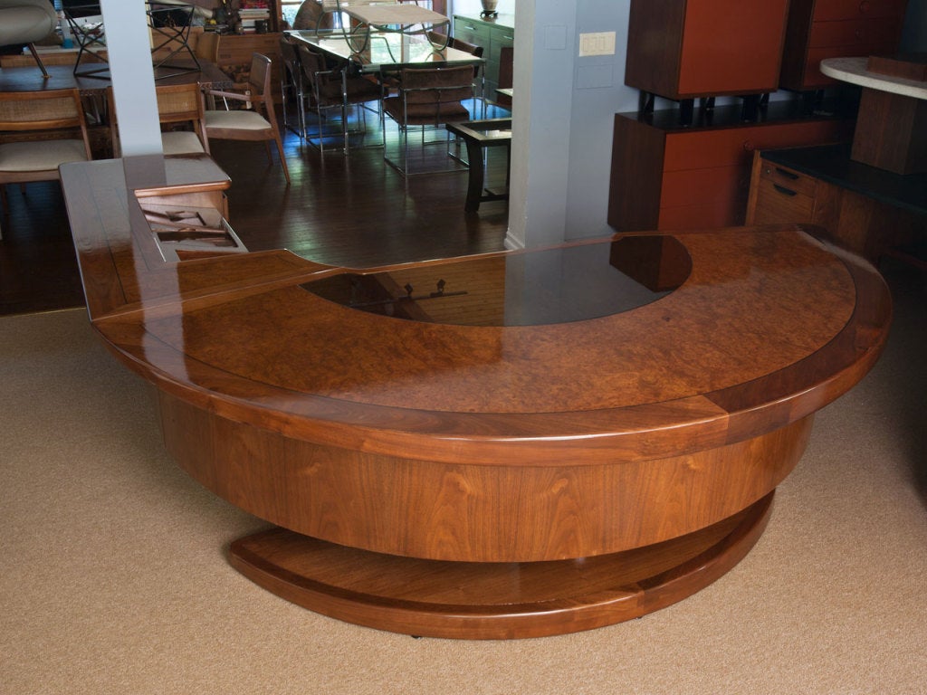 Monumental rare executive desk with return by MAURICE BAILY of MONTEVERDE YOUNG.  Beautiful combination of burl wood and walnut.   Desk floats on a pedestal.  Superior craftsmanship.  Signed to interior of the drawers.