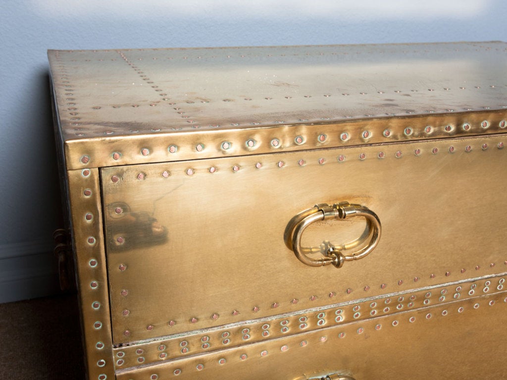 Pair of studded brass chest by SARREID Ltd. of Spain.  Work well as nightstands, end and coffee tables.  Finished back.  Price is for the pair.