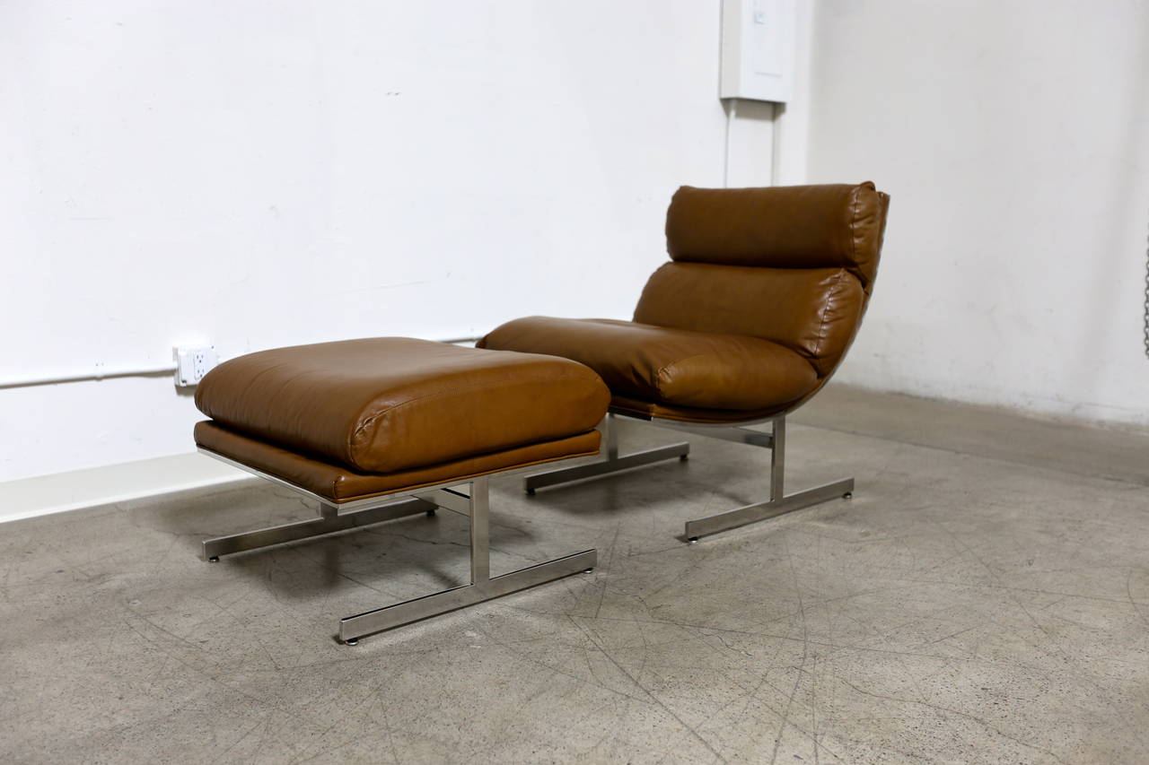 Pair of lounge chairs and ottoman by Kipp Stewart for Directional. The ottoman measures 26