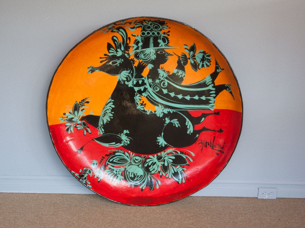 Large hand painted and signed paper mache plate / charger by Bjorn Wiinblad of Denmark.  Measures 41 3/4