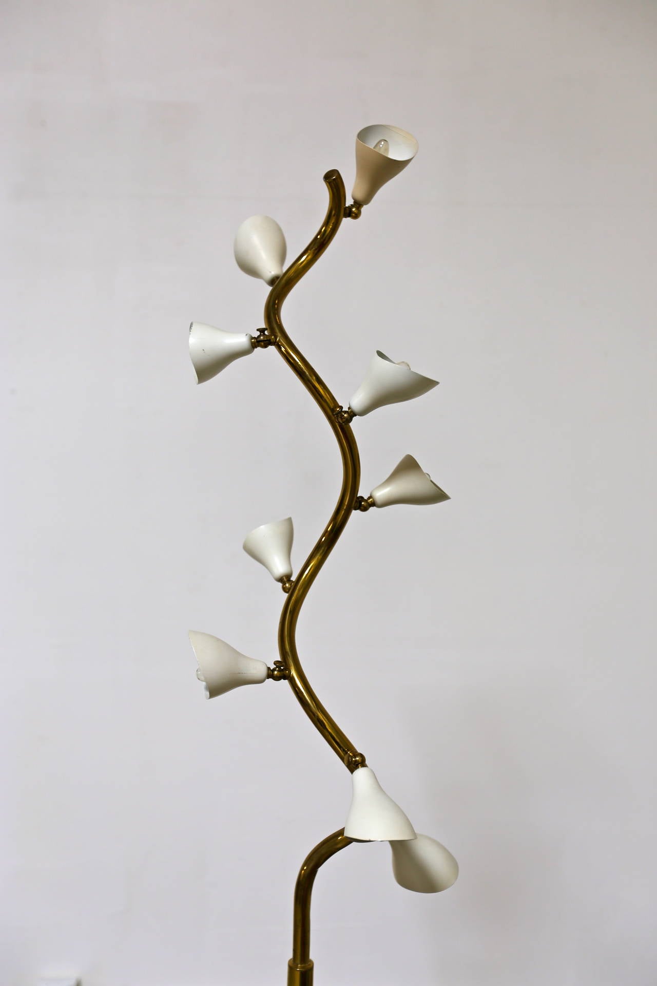 A fine original example of Gino Sarfatti’s floor lamp with nine adjustable shades. Signed Arteluce Made in Italy. The base is marble.