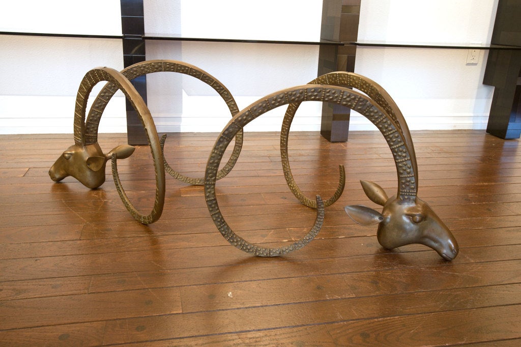 Sculptural ibex brass gazelle rams head coffee table.  Beautiful patina.  Measured per base.  Style of Leon Francois Chervet.