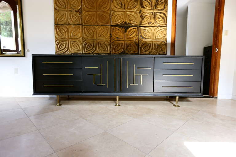 Custom Leather Wrapped Credenza With Solid Brass Accents.  Slightly Curved Front. Brass Trumpet Legs.