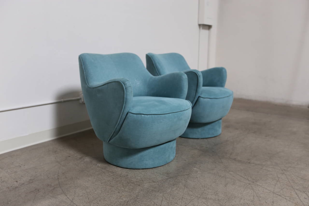 Pair of barrel swivel lounge chairs by Vladimir Kagan for Directional.