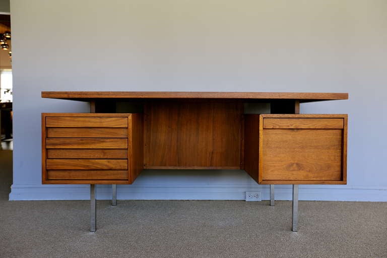 Walnut executive desk by John Keal for Brown Saltman.  Nice floating top with chrome legs and a bookcase / storage to the front.