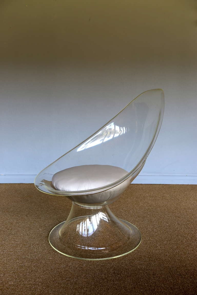 Invisible lucite chair by Laverne.