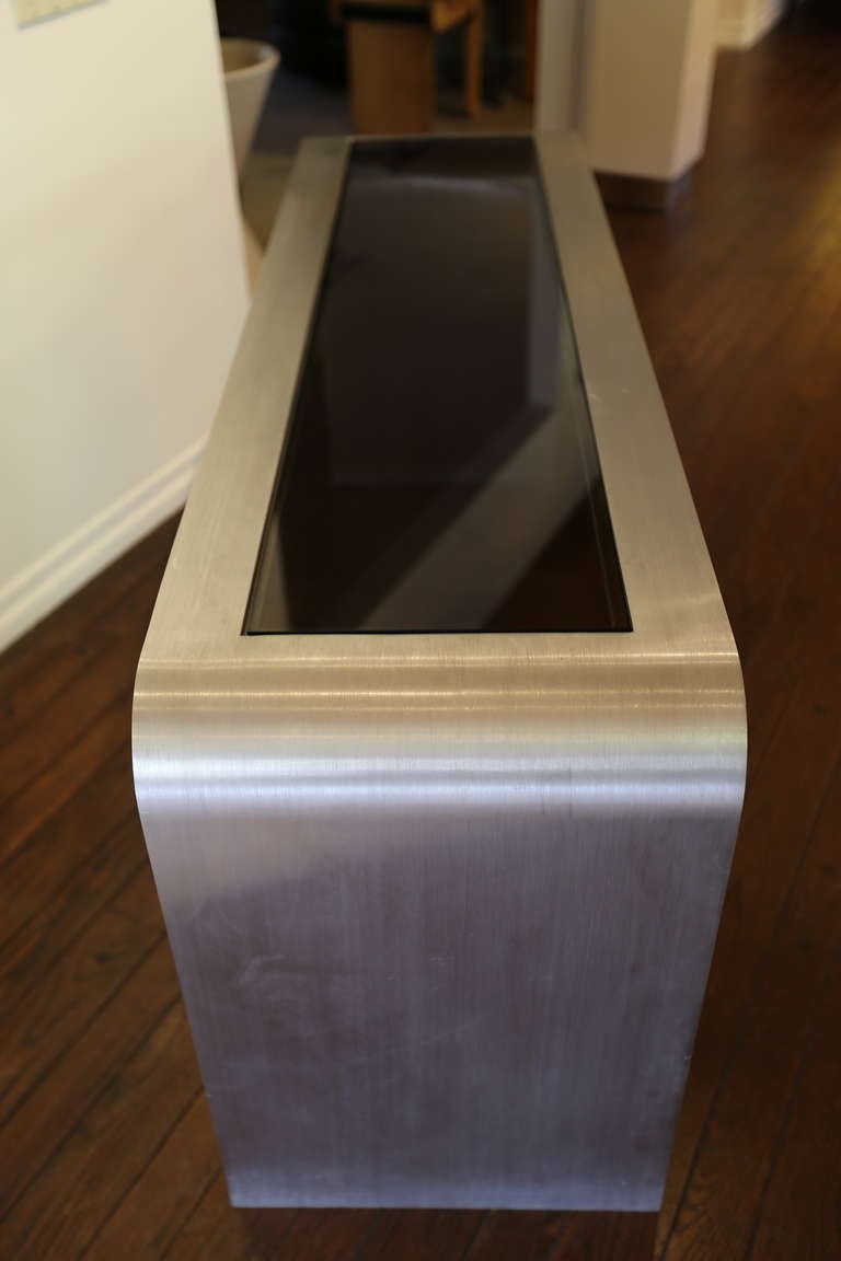 Brushed stainless steel console table by Leon Rosen In Fair Condition In San Juan Capistrano, CA