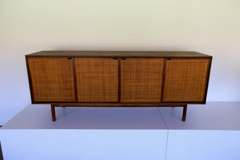 Walnut and Cane Front Credenza by Florence Knoll.