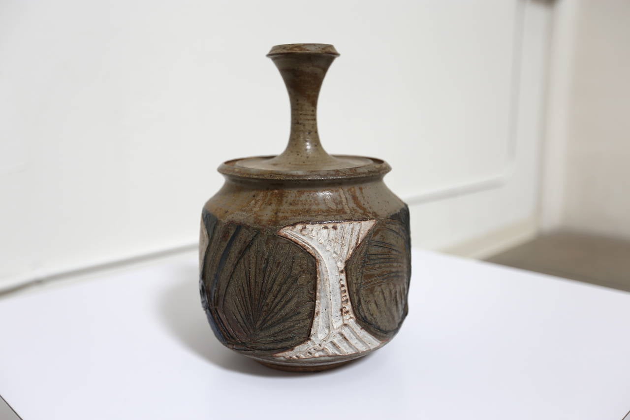 Lidded stoneware vessel by Joel Edwards.