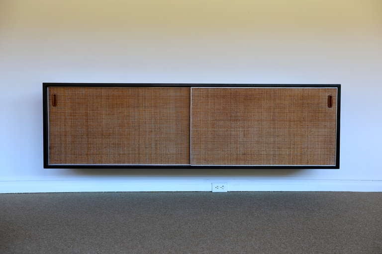 Ebonized walnut & cane hanging credenza ( 2 available )