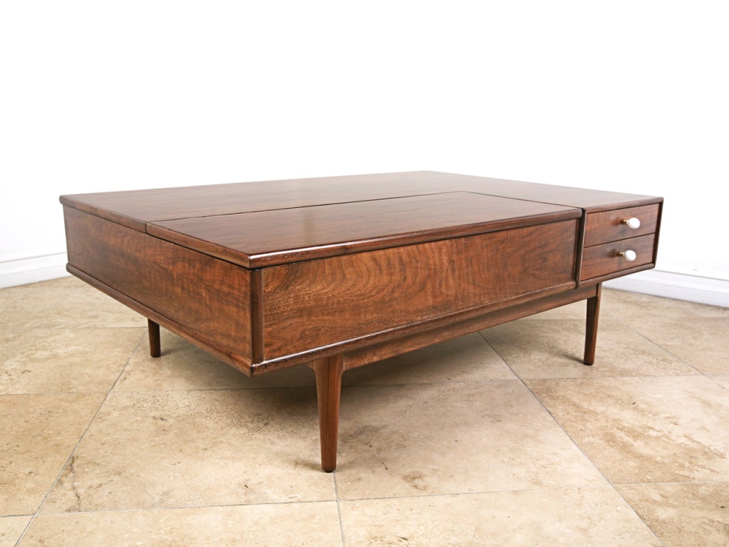 Walnut coffee table designed by Kipp Stewart and Stewart MacDougal for Drexel.  This piece offers multiple storage options.