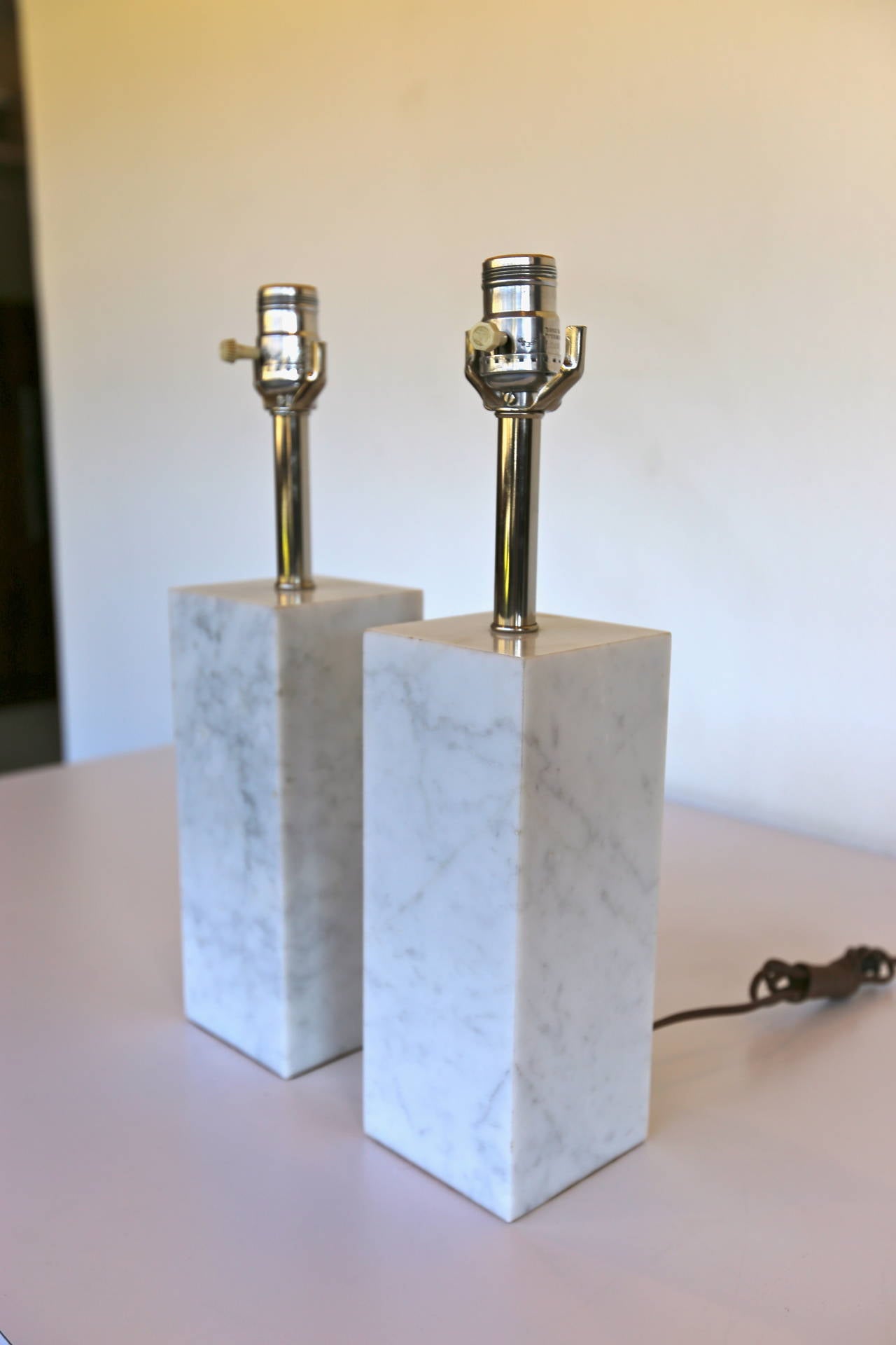 Pair of petite white marble table lamps.