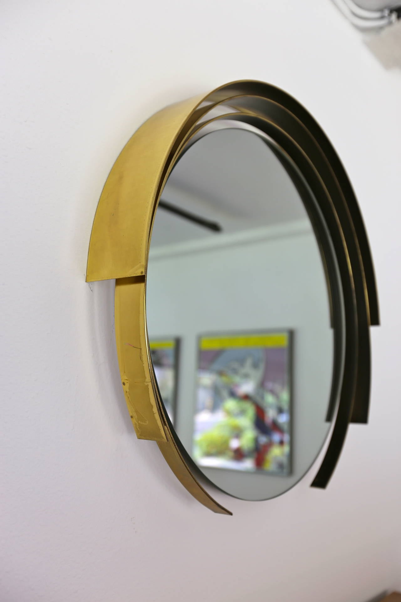 Round brass modernist mirror signed C.Jere, 1982. (Curtis Jere).