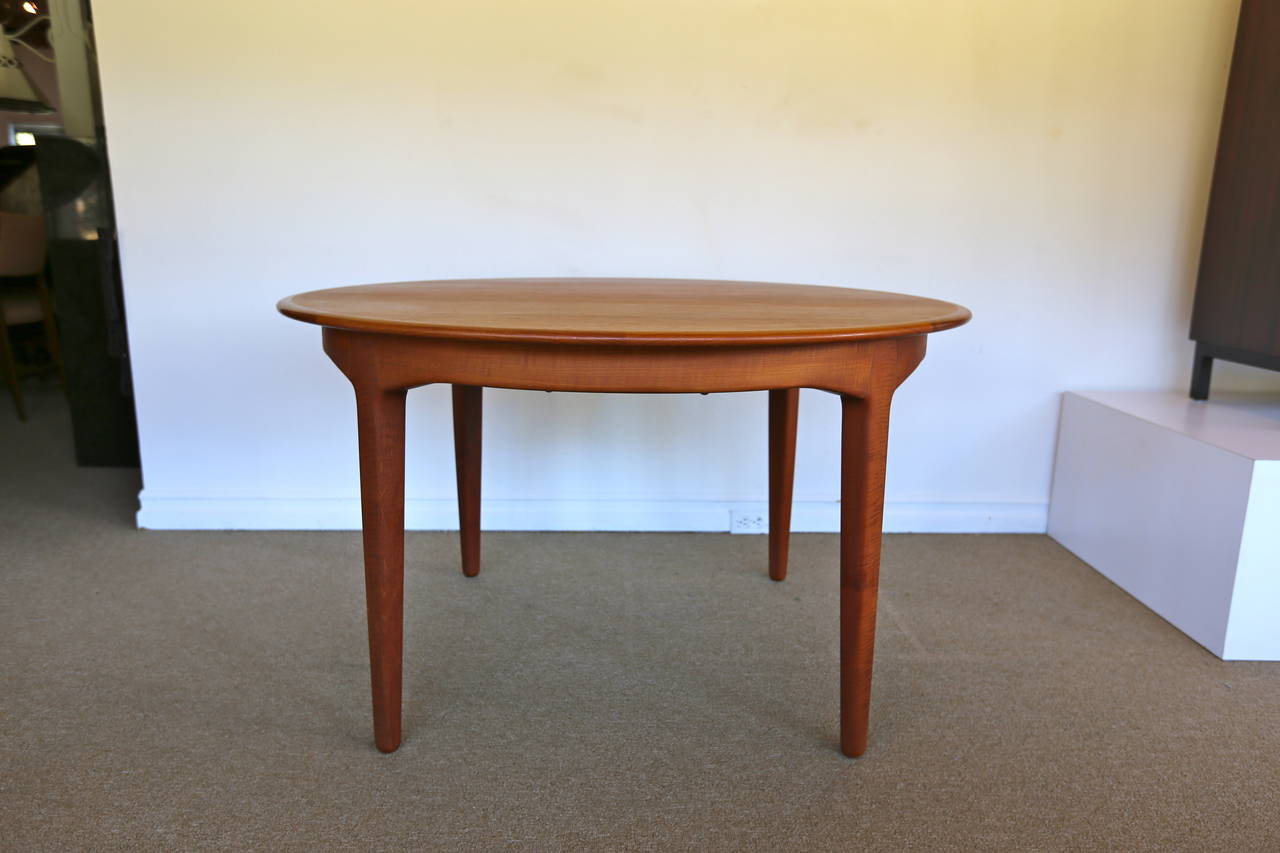 Henning Kjaernulf dining table for Soro Stole, Denmark. This piece has four leaves at 20