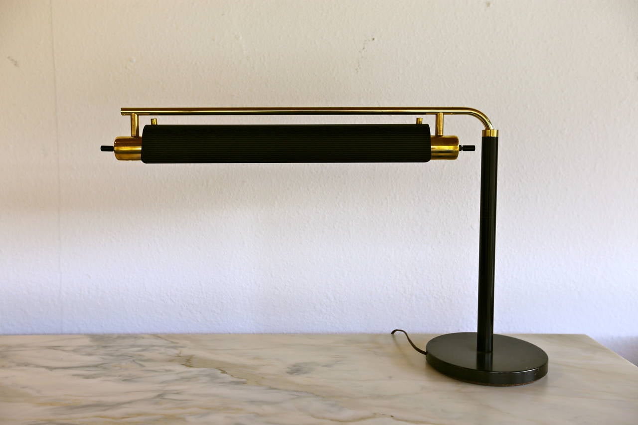Desk lamp by Lightolier. This lamp shade is adjustable both vertically and swings from side to side.