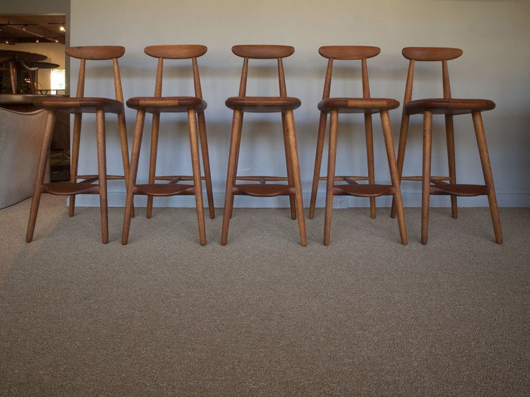 Teak, Ash and Leather barstools by VILHELM WOHLERT for ODENSE MOBELFABRIK.  Five available priced individually. 