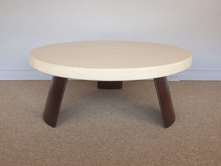 Round cork top table by PAUL FRANKL for JOHNSON FURNITURE.  Lacquered cork supported by three thick mahogany legs. 