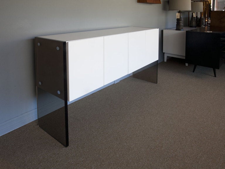 Smoked lucite and high gloss white enamel credenza by MILO BAUGHMAN for THAYER COGGIN.
