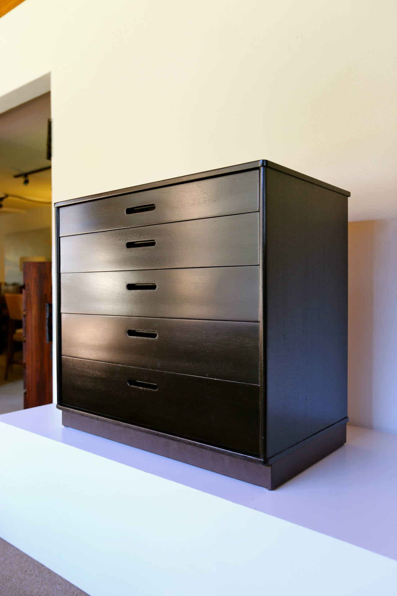 Ebonized chest or dresser by Edward Wormley for Dunbar. Leather wrapped base.

   MOVING SALE !!!