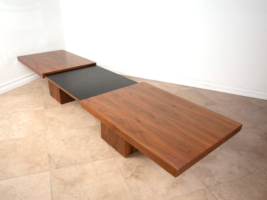 California modern expanding walnut coffee table by John Keal for Brown Saltman.  Beautifully figured walnut grain.  Measures 15