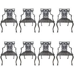 Set of eight Neoclassical cast iron arm chairs