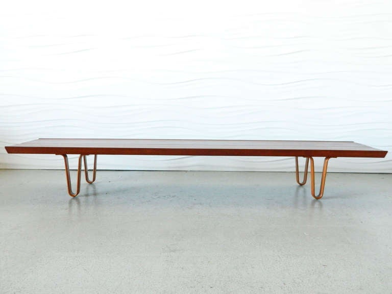 This striking Long John Bench by American designer Edward Wormley for Dunbar is made of walnut and has its original paper label.