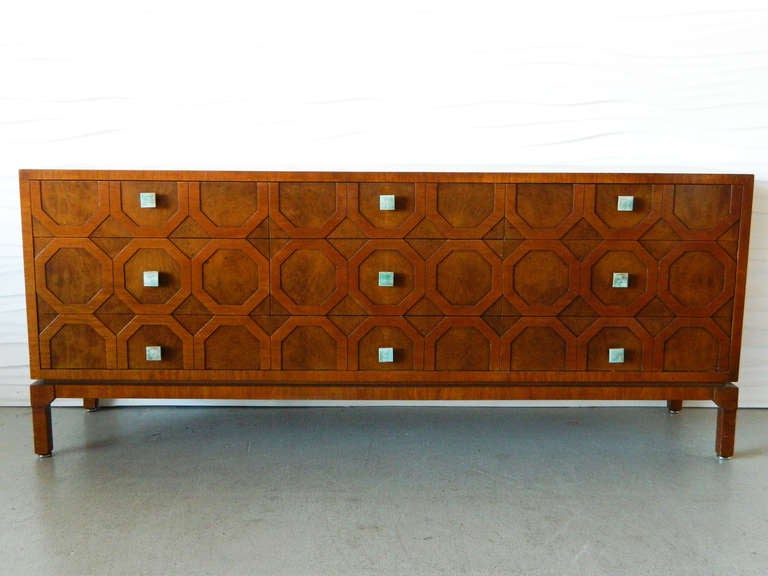 This handsome burl dresser has an interesting hexagon motif and nine large drawers with ceramic tile hardware. Made by Romweber.