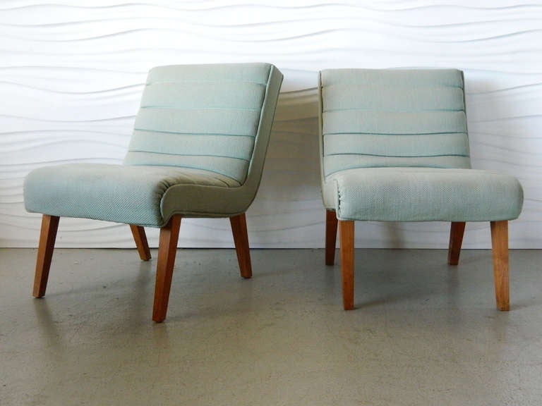 Handsome pair of American Modern slipper chairs in the style of Paul Laszlo.