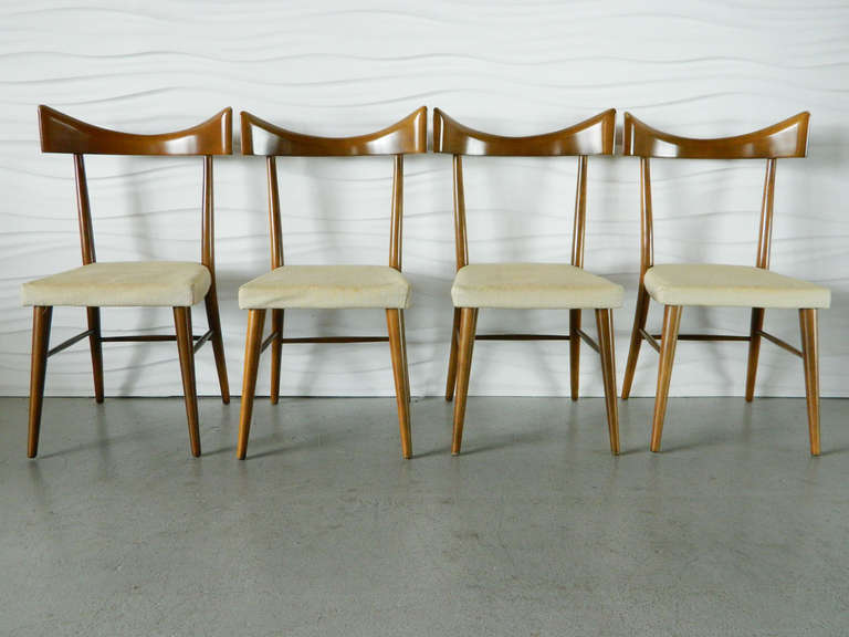 Stunning set of four Paul McCobb dining chairs with sculptural back supports.