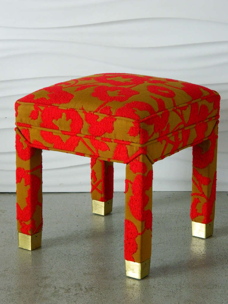 Vibrant red poppies pop against the green-gold background of this brass capped ottoman. Custom made in the 1970s.