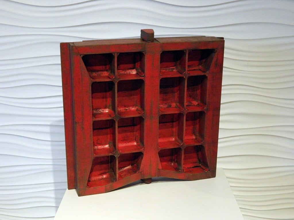 This Industrial wooden mold would make an unusual wall hanging or modern curio shelf.