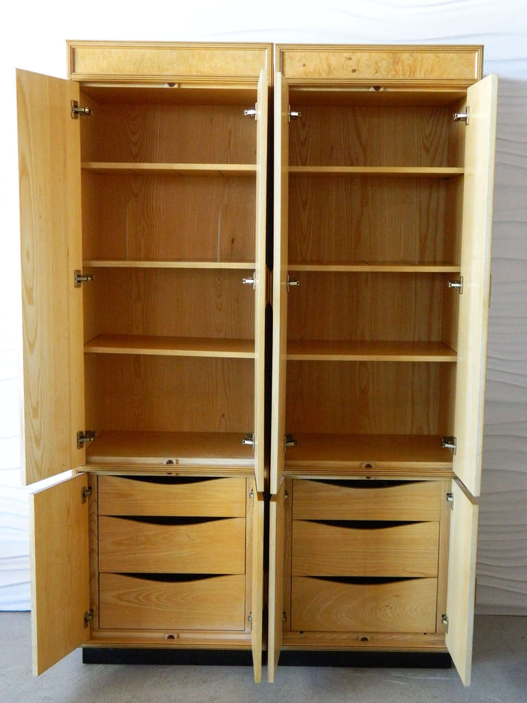 Stunning pair of olive burl armoires/cabinets from the Henredon Scene Two Collection of the 1970s. Each armoire/cabinet features open shelving and three drawers.