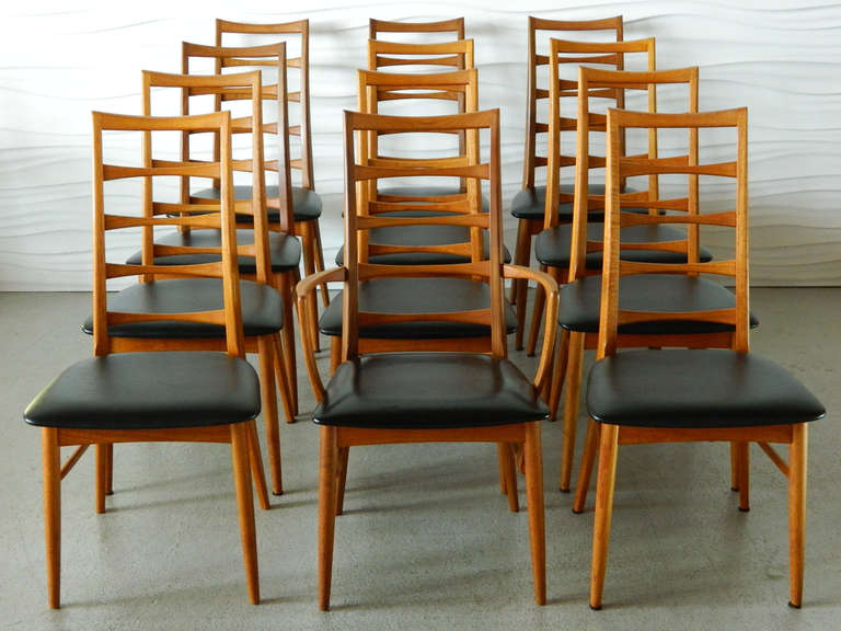 This set of Danish teak Koefoeds Hornslet chairs consists of 11 side chairs and one arm chair. The set is a marriage of two groups from different production years. 

Group A (seven side chairs)
Matte Finish Vinyl Seats
Bent Ply