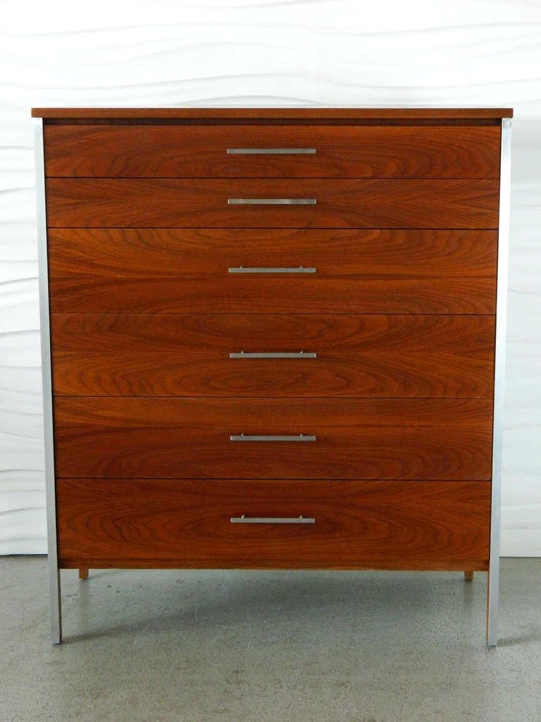 This handsome six-drawer walnut chest of drawers with aluminum pulls and trim was designed by American designer Paul McCobb for Calvin Furniture.