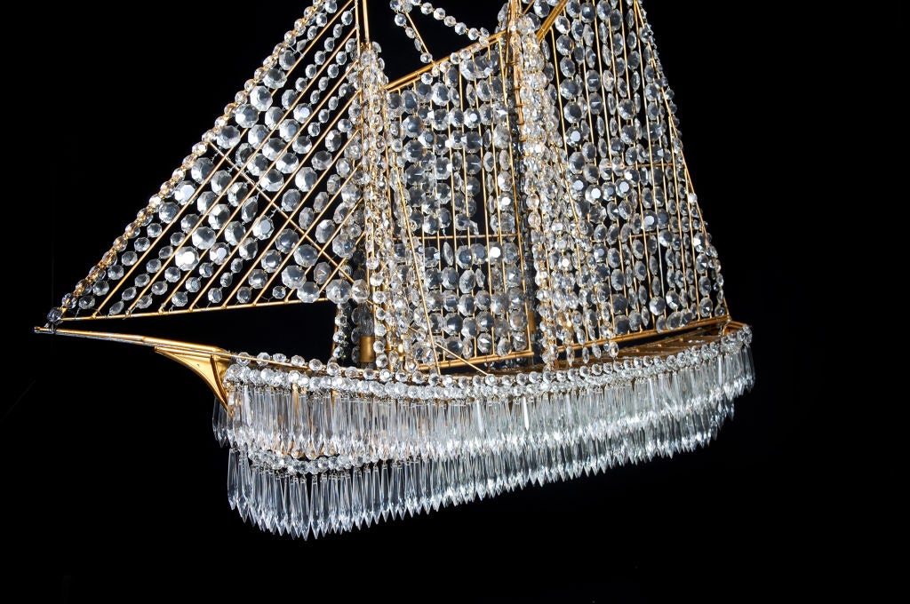A spectacular & large Antique French gilt bronze & cut crystal multi light double sided ship chandelier of great detail and workmanship by BAGUES,ca.1920's.