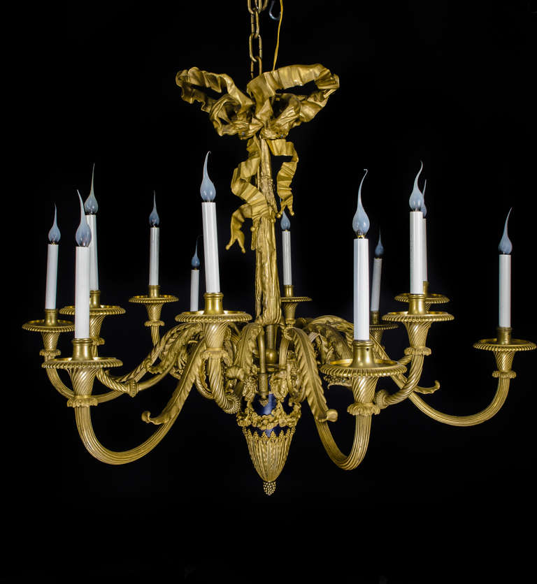 A Magnificent ,Large & Palatial Antique French Louis XVI gilt bronze & patinated bronze multi light chandelier of fine quality embellished with floral wreaths, figural masks & further adorned with a large ribbon on the top,19th century.