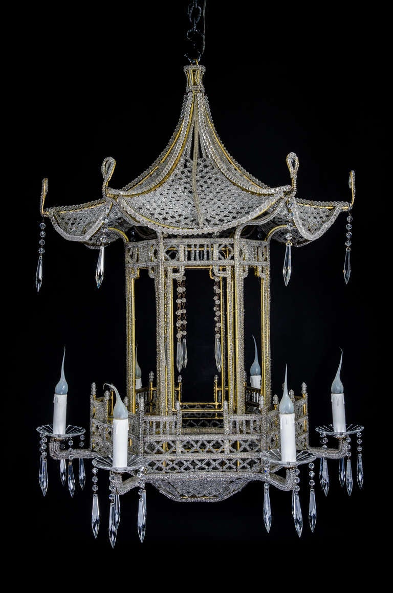 A Unique Italian gilt bronze, beaded crystal & cut crystal multi arm chinoiserie Pagoda form chandelier of exquisite craftsmanship.